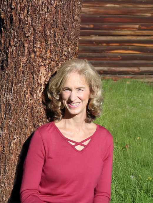 a woman smiling while talking with her therapist