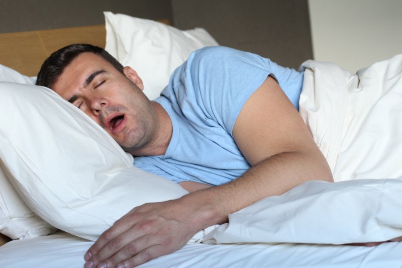 Man drooling in bed